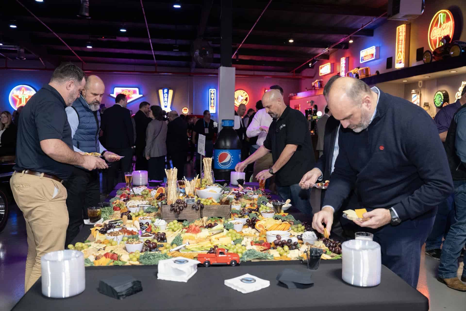 People enjoying food and drinks at Highway 39 Event Center celebration.