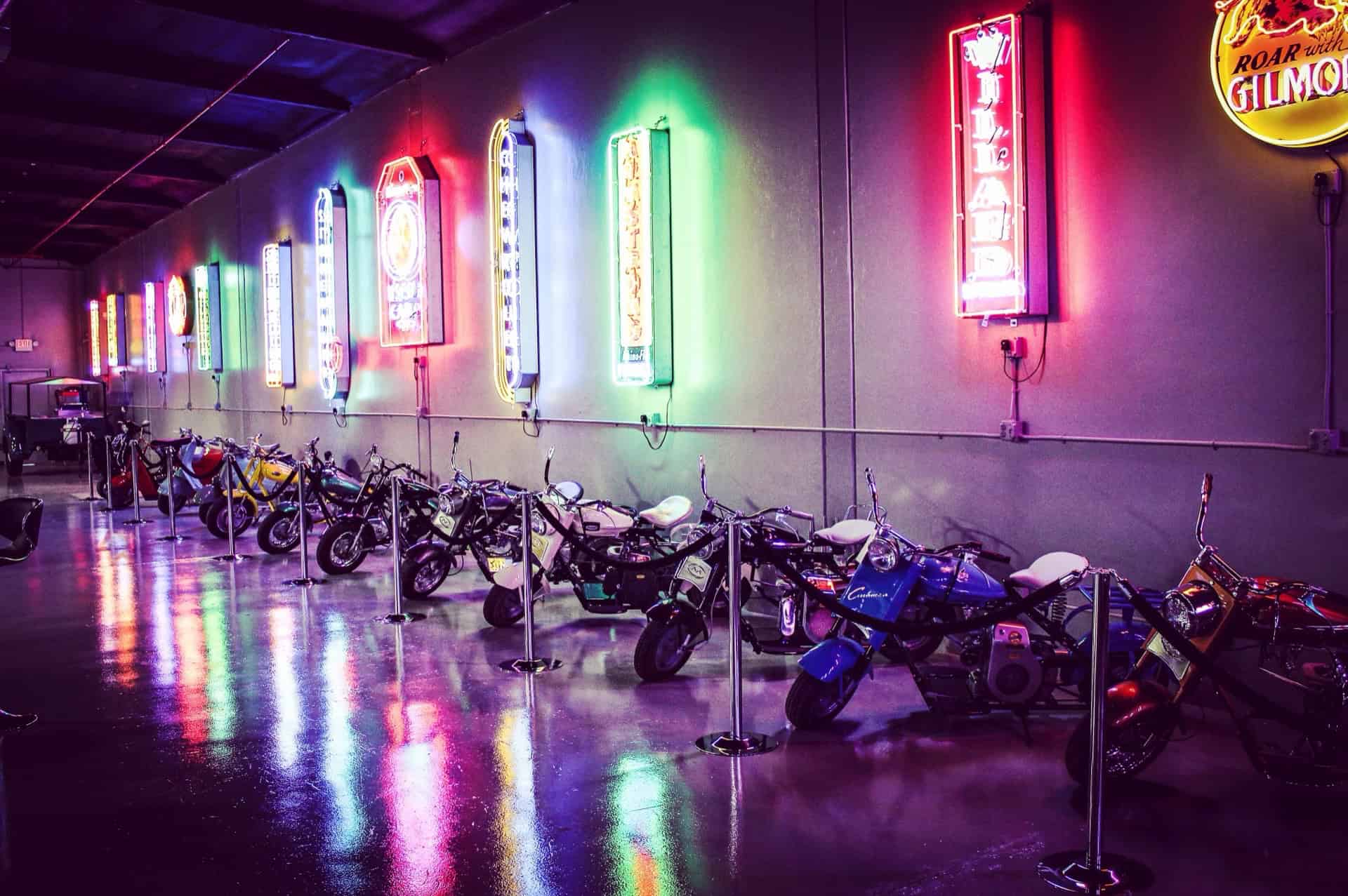 Neon-lit motorcycle display at Highway 39 Event Center, vibrant and colorful.